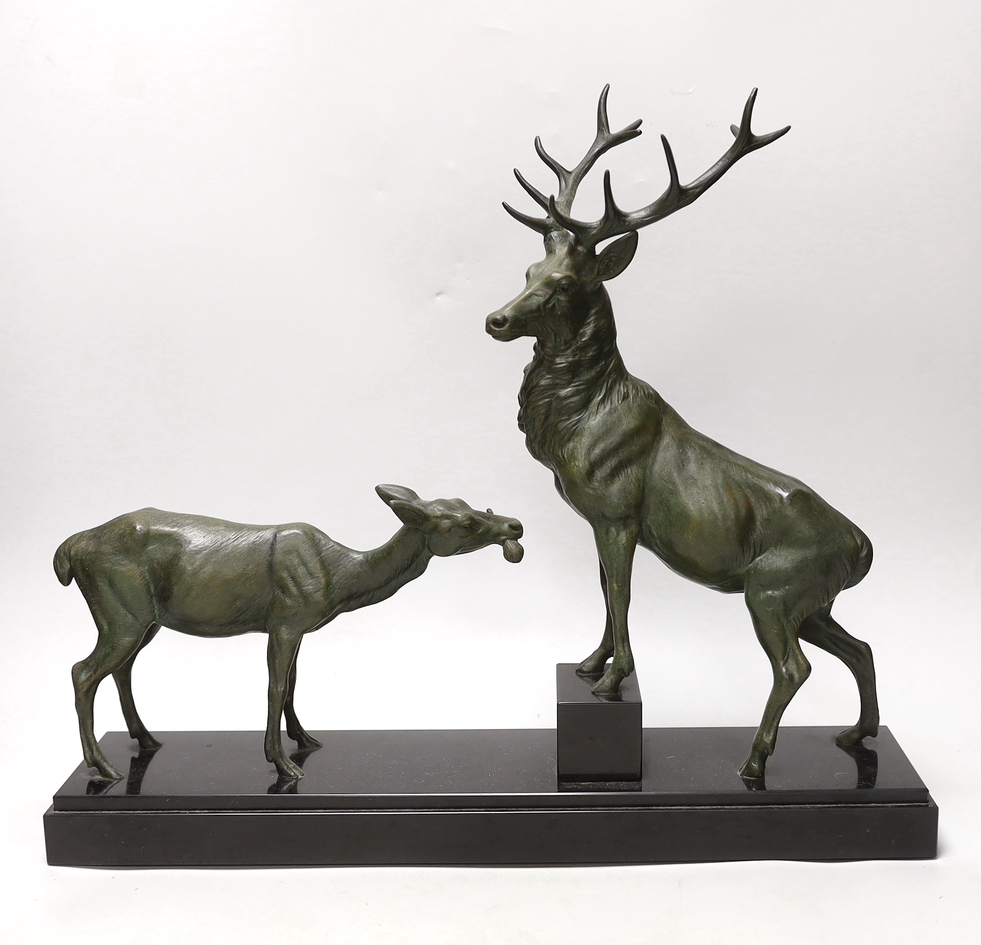 After Louis-Albert Carvin (1875–1951). A spelter group of a stag and faun, signed to base. 41cm tall